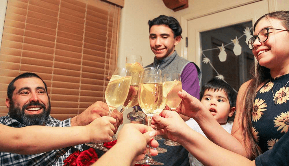 Family gathered at home on New Year evening sharing warmth and quiet gratitude