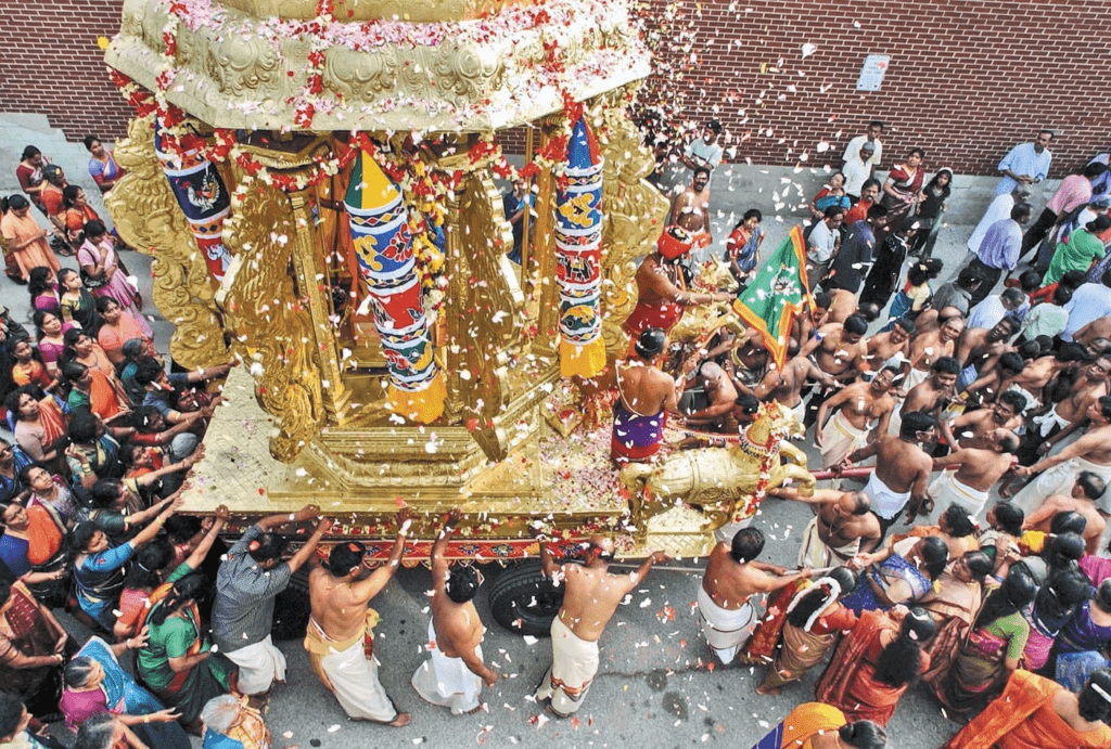 Devotees offering food and essentials as charity during Makar Sankranti