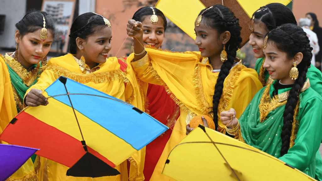 Devotees wearing yellow and white attire during Saraswati Puja following symbolic tradition